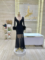 Load image into Gallery viewer, A classic black, sleeveless cocktail dress with a simple silhouette, ideal for a formal occasion.