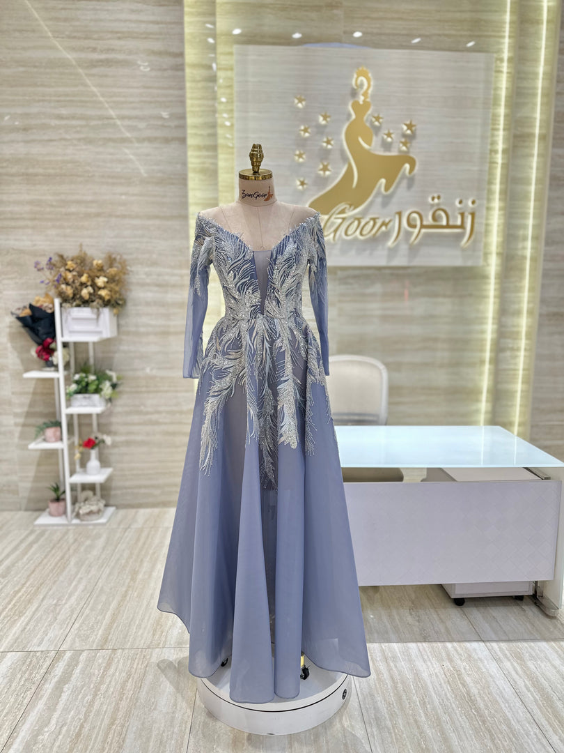 A captivating mauve, double-cloche dress with a flattering waistline, perfect for a special occasion.exclamation