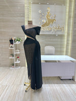 Load image into Gallery viewer, A stunning gold, off-the-shoulder maxi dress with a flowing skirt, perfect for a summer evening party.