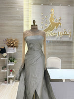 Load image into Gallery viewer, A soft peach, single-cloche dress with elegant sleeves, perfect for a family gathering.