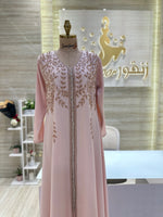 Load image into Gallery viewer, A stunning gold, off-the-shoulder maxi dress with a flowing skirt, perfect for a summer evening party.