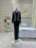 Load image into Gallery viewer, A flowing, sleeveless maxi dress in a soft, shimmering fabric, perfect for a summer evening