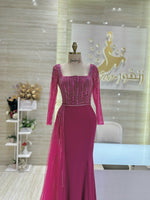 Load image into Gallery viewer, A shimmering, silver, sleeveless gown with a flowing skirt, perfect for a formal event.exclamation