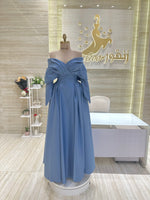 Load image into Gallery viewer, A stunning gold, off-the-shoulder maxi dress with a flowing skirt, perfect for a summer evening party.