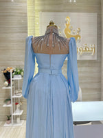 Load image into Gallery viewer, A flowing, sleeveless maxi dress in a soft, shimmering fabric, perfect for a summer evening