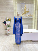 Load image into Gallery viewer, A shimmering, silver, sleeveless gown with a flowing skirt, perfect for a formal event.exclamation