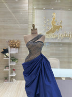 Load image into Gallery viewer, A flowing, sleeveless maxi dress in a soft, shimmering fabric, perfect for a summer evening