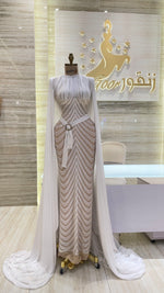 Load image into Gallery viewer, A vibrant red, double-cloche dress with a daring off-shoulder cut, ideal for a night out.