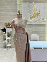 Load image into Gallery viewer, A soft pink, off-the-shoulder dress with delicate lace details, perfect for an engagement party.