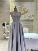 Load image into Gallery viewer, A soft pink, off-the-shoulder dress with delicate lace details, perfect for an engagement party.