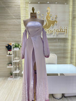 Load image into Gallery viewer, A flowing, sleeveless maxi dress in a soft, shimmering fabric, perfect for a summer evening