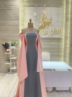 Load image into Gallery viewer, A stunning gold, off-the-shoulder maxi dress with a flowing skirt, perfect for a summer evening party.