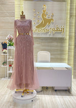 Load image into Gallery viewer, A stunning gold, off-the-shoulder maxi dress with a flowing skirt, perfect for a summer evening party.