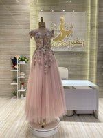 Load image into Gallery viewer, A soft peach, single-cloche dress with elegant sleeves, perfect for a family gathering.