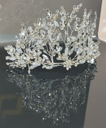 Load image into Gallery viewer, A stunning gold, off-the-shoulder maxi dress with a flowing skirt, perfect for a summer evening party.