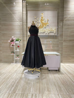 Load image into Gallery viewer, A shimmering, silver, sleeveless gown with a flowing skirt, perfect for a formal event.exclamation