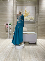 Load image into Gallery viewer, A flowing, sleeveless maxi dress in a soft, shimmering fabric, perfect for a summer evening