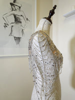 Load image into Gallery viewer, A vintage-inspired double-cloche dress with a flattering silhouette, ideal for a special occasion