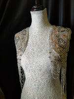 Load image into Gallery viewer, A flowing, sleeveless maxi dress in a soft, shimmering fabric, perfect for a summer evening