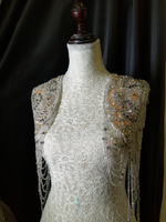 Load image into Gallery viewer, A shimmering, silver, sleeveless gown with a flowing skirt, perfect for a formal event.exclamation