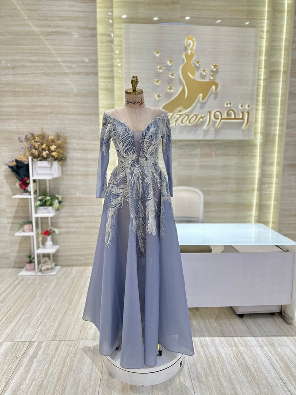 A captivating mauve, double-cloche dress with a flattering waistline, perfect for a special occasion.exclamation