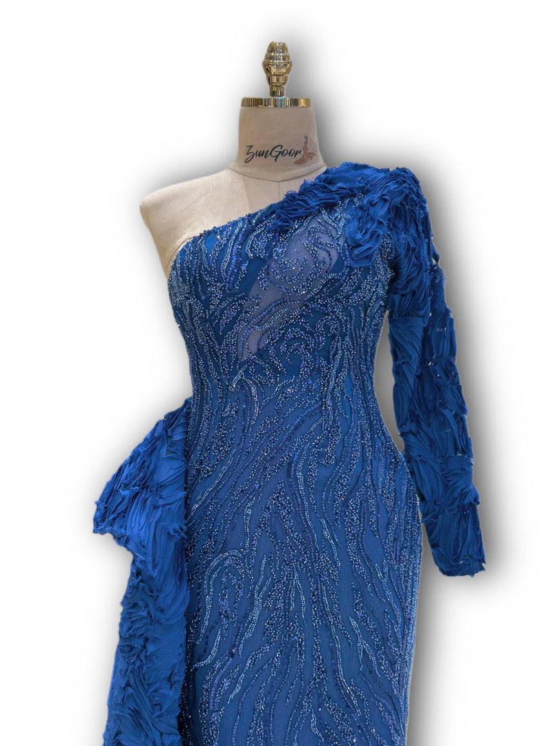 Handmade dress, striking blue color, long design with single sleeve.