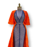 Load image into Gallery viewer, A soft peach, single-cloche dress with elegant sleeves, perfect for a family gathering.
