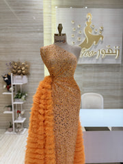 A shimmering, silver, sleeveless gown with a flowing skirt, perfect for a formal event.exclamation