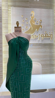 A stunning gold, off-the-shoulder maxi dress with a flowing skirt, perfect for a summer evening party.