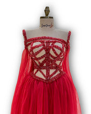 A vibrant fuchsia, sleeveless party dress with a playful skirt, ideal for a night out with friends.