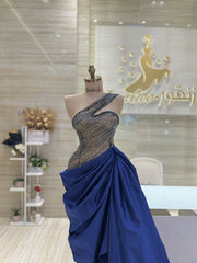 A flowing, sleeveless maxi dress in a soft, shimmering fabric, perfect for a summer evening