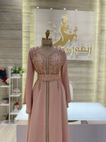 Load image into Gallery viewer, A soft peach, single-cloche dress with elegant sleeves, perfect for a family gathering.
