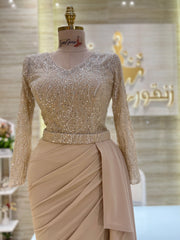 A stunning gold, off-the-shoulder maxi dress with a flowing skirt, perfect for a summer evening party.