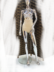 A flowing, sleeveless maxi dress in a soft, shimmering fabric, perfect for a summer evening