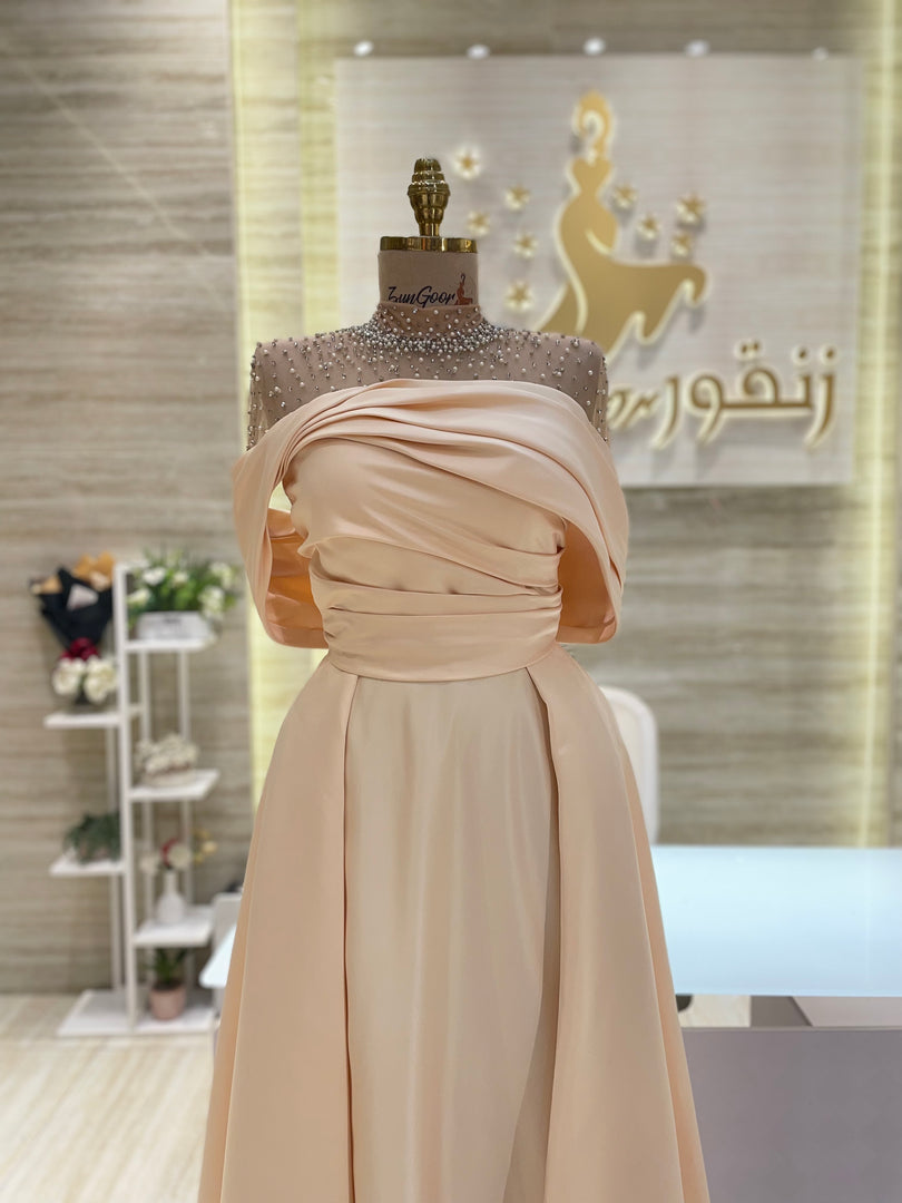 A captivating mauve, double-cloche dress with a flattering waistline, perfect for a special occasion.exclamation