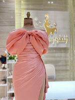 Load image into Gallery viewer, A soft peach, single-cloche dress with elegant sleeves, perfect for a family gathering.
